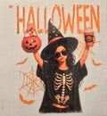 Halloween witch in a skeleton shirt holding a pumpkin bucket
