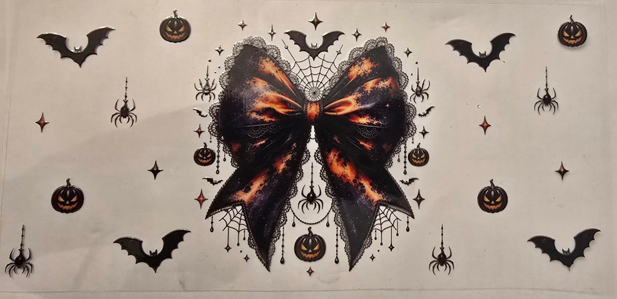 Black and orange Halloween bow with bats, spiders, and pumpkins