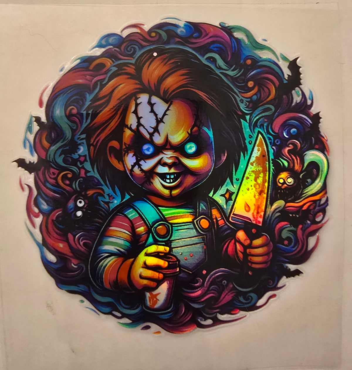 Colorful Chucky Halloween design with knife and bats