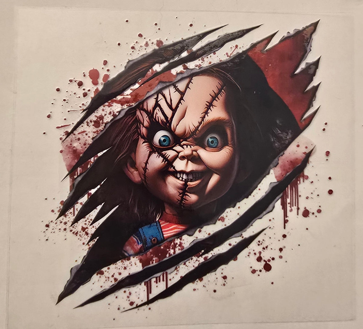 Chucky portrait with slash marks and blood splatter