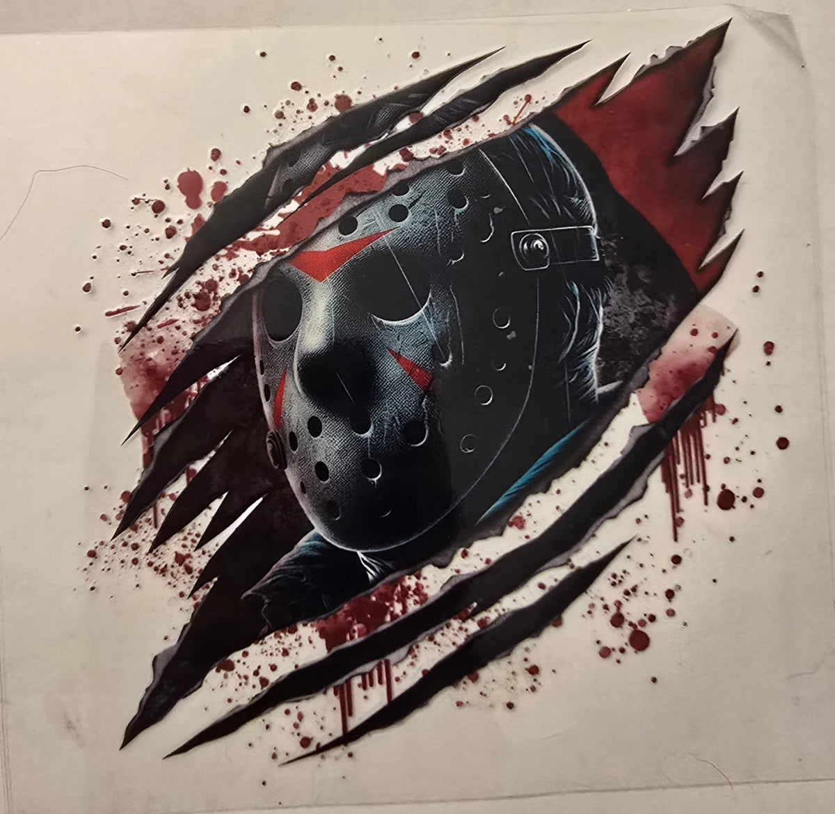 Jason mask with slash marks and blood splatter